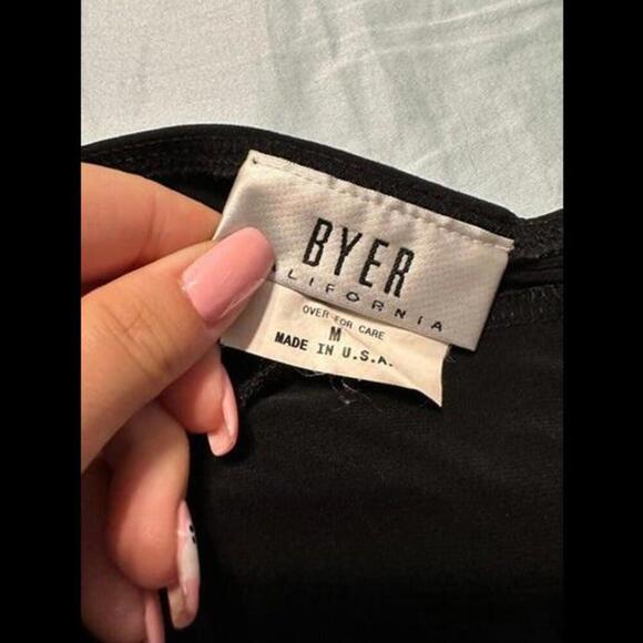 Be the Life of the Party with this Chic Black Halter Flowy Top! - Picture 2 of 3